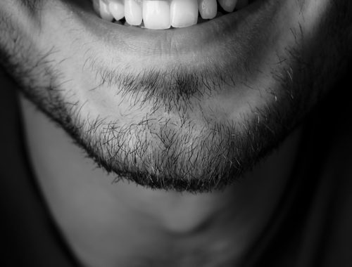 grayscale photo of mans face